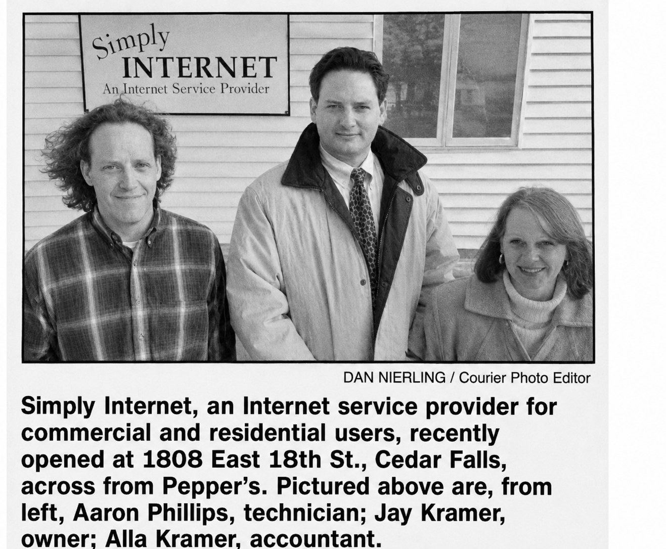Actual newspaper clipping: Simply Internet, an Internet service provider in Cedar Falls — pictured from left, Aaron Phillips, technician; Jay Kramer, owner; Alla Kramer, accountant